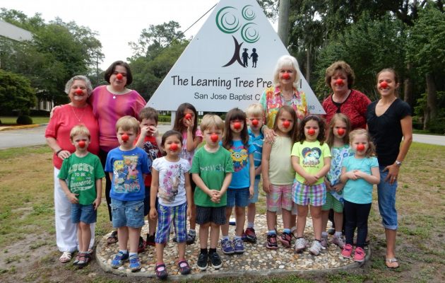 Preschoolers don red noses to help children in need
