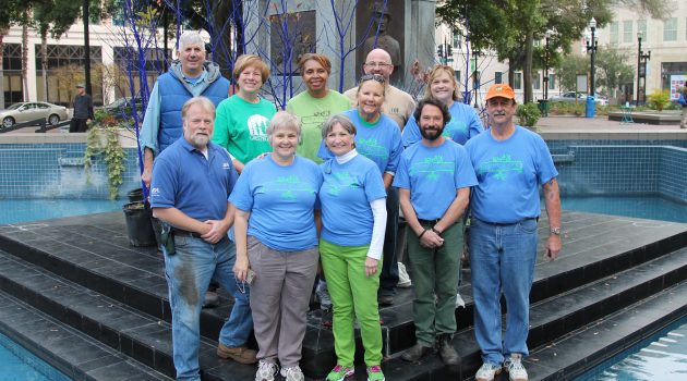 Residents paint trees blue for art and awareness