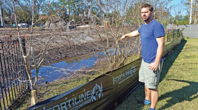 Residents threaten lawsuit unless drainage issue fixed