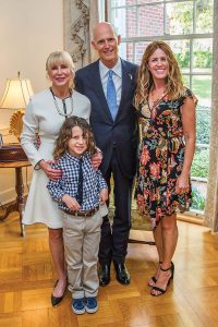 First Lady Ann Scott and Julian Bowie (left), Gov. Rick Scott, and Christy Bowie  (Photo by Jesse Romimora)