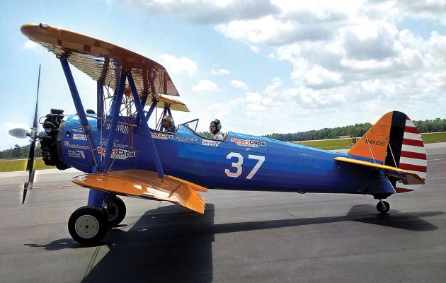 Military veterans take flight in restored biplane