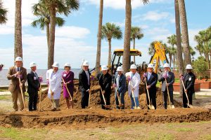 Ceremonial groundbreaking by Sen. Aaron Bean, name, Dr. Paul Chappano, Jane Lanier, Tom VanOsdol, Bishop Felipe Estévez, Dr. Samer Garas, Dr. Michael Mostovych, Steve Halverson, Joe Bucci, and Father Leonard Chuwa