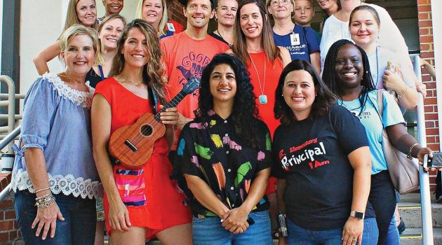 Grammy artist surprises elementary school for flag raising