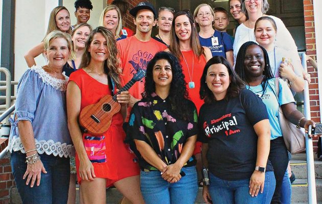 Grammy artist surprises elementary school for flag raising