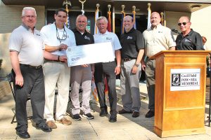 Ray Gottry, Mike Cassata, Buddy Harris, Sam Houston, Edmund Turner, Dean Leonard, and Bob Buehn at a check presentation from LSI, Inc. prior to the dedication ceremony.