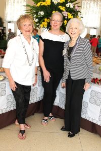 Sonya Petit, Irene Woodworth and Bobby Arnold in front of the centerpiece they created for the Garden Club’s open house.