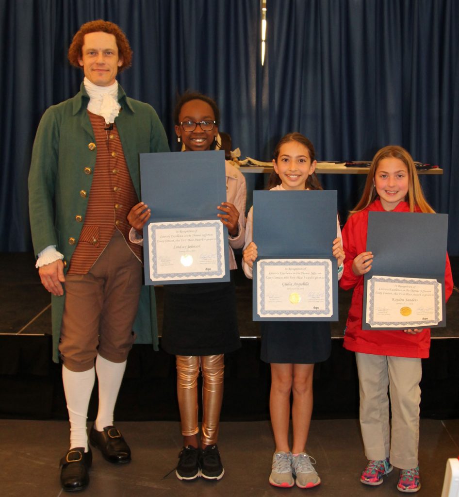 Thomas Jefferson with three of the essay contest winners: Lindsay Johnson, R.V. Daniels Elementary; Giulia Angiolillo, Riverside Presbyterian Day School, and Kayden Sanders, St. Mark’s Episcopal Day School