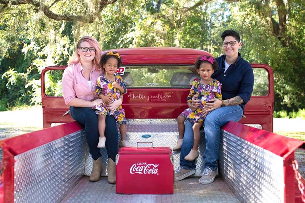 Jessica Hamm with her daughter Delilah and fiancée Jennifer Paez, holding Caroline.
