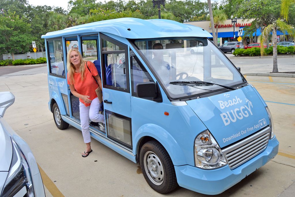 Nina Cliff exits the Beach Buggy van after taking a trip from 1st Place Sports to Southern Grounds Coffee House June 15.