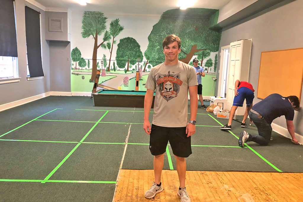 Reid Hampton in the carpet removal phase of his Eagle Scout project at Riverside Park United Methodist Church.