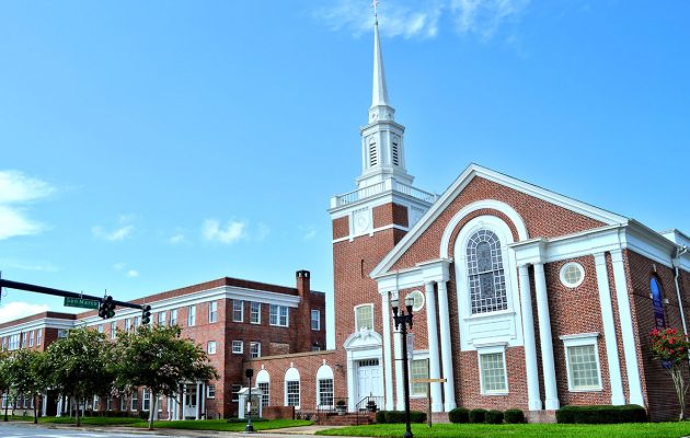 Developer works on architectural changes amidst opposition to church development