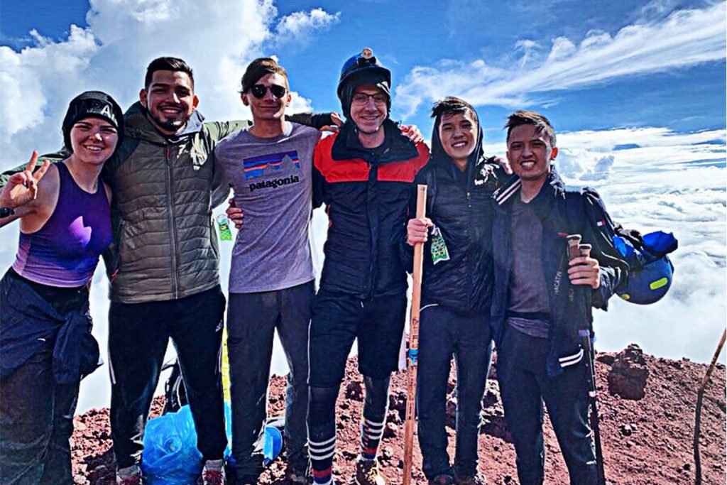 After hiking off and on for two days, Cheyenne Shrader, left, Mynor Urrutia, Justin Shrader and some of the others in the group, take a moment to record their accomplishment of reaching the peak of Mt. Fuji, Japan’s highest strato-volcanic mountain at 12,389 feet tall.