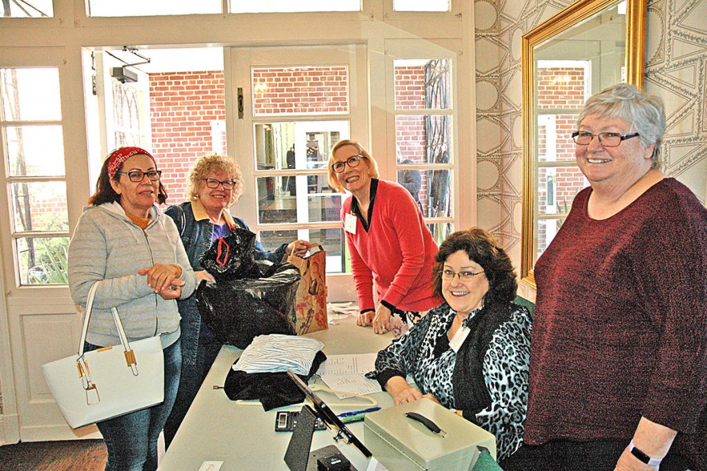 From left, Belkis Sanchez, Christi Veleta, Becky Cox, Janet Chamberlain, and event chair Lauren Baxter, president of the Empire Point Garden Circle, participate in the Garden Club of Jacksonville’s Flea Market fundraiser.
