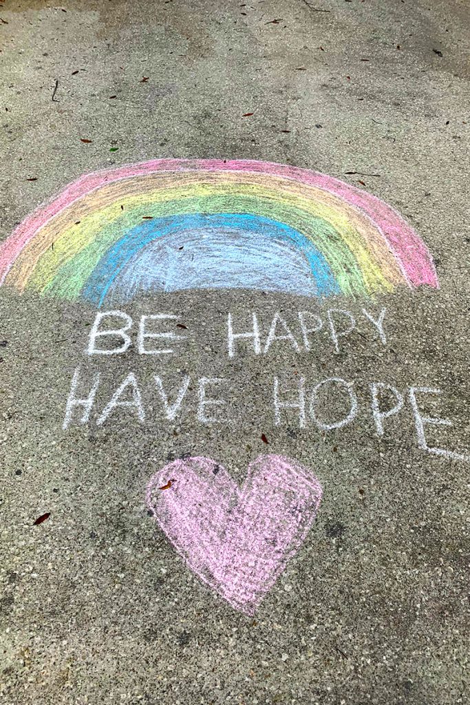 Colorful chalk rainbows have cropped up on driveways in the neighborhood