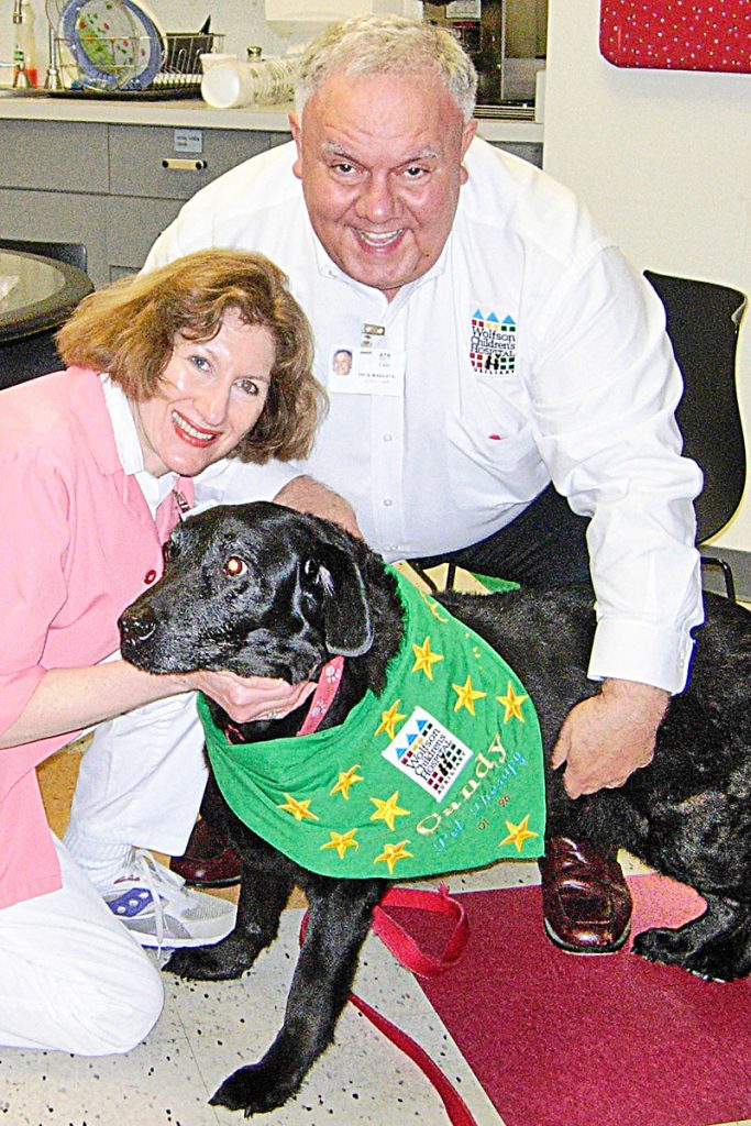 Catie and Dick Wallace with therapy dog, Candy