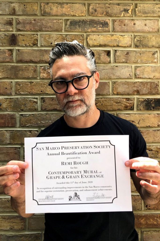 London artist Remi Rough and his beautification award for his mural in San Marco Square.