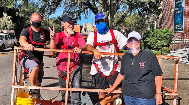 ‘Flying nun’ replaces protective covering over historic church windows