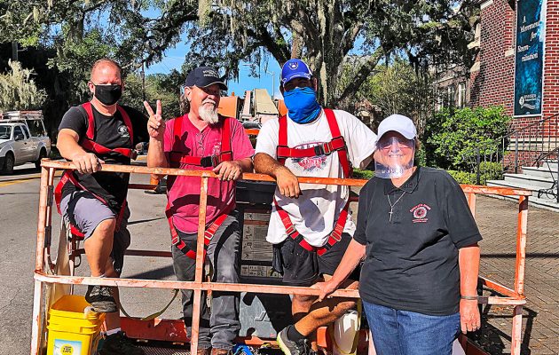 ‘Flying nun’ replaces protective covering over historic church windows