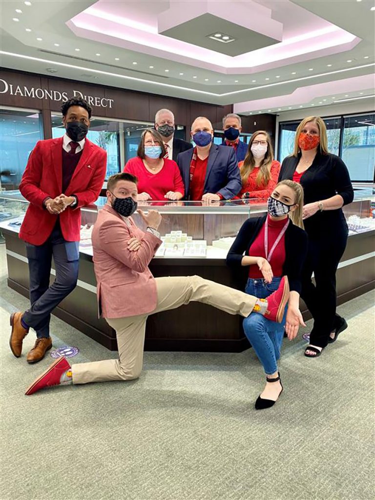 Employees at Diamonds Direct flash their red in support of the American Heart Association’s National Wear Red Day.