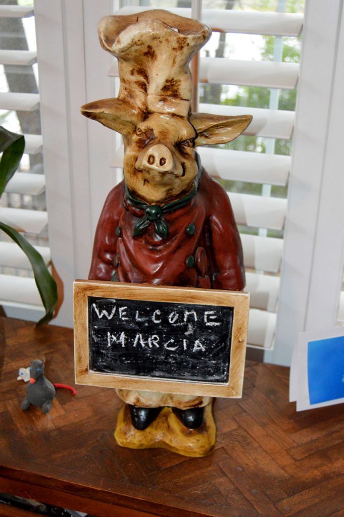 A second pig named Guiseppe greets visitors in Tony Vecchio’s dining room.