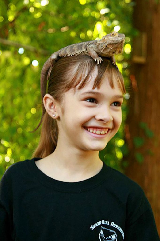 Calla Titterington, 7, with Phoebe, her super-friendly  Bearded Dragon.