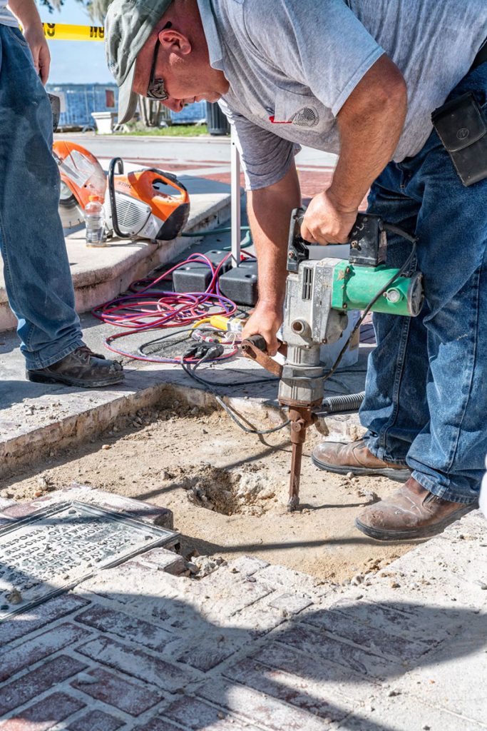 The metal ground plaque indicating the site of the Life Scrolls is in the lower left corner of the photo. The process to unearth the scrolls began in September 2018. (Photo courtesy of Mark Krancer, Kram Kran Photo, for Memorial Park Association)