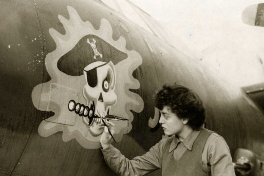 Kuzel’s mother, Barbara O’Brien Kuzel, 9th Air Force in England, paints the nose on a bomber.