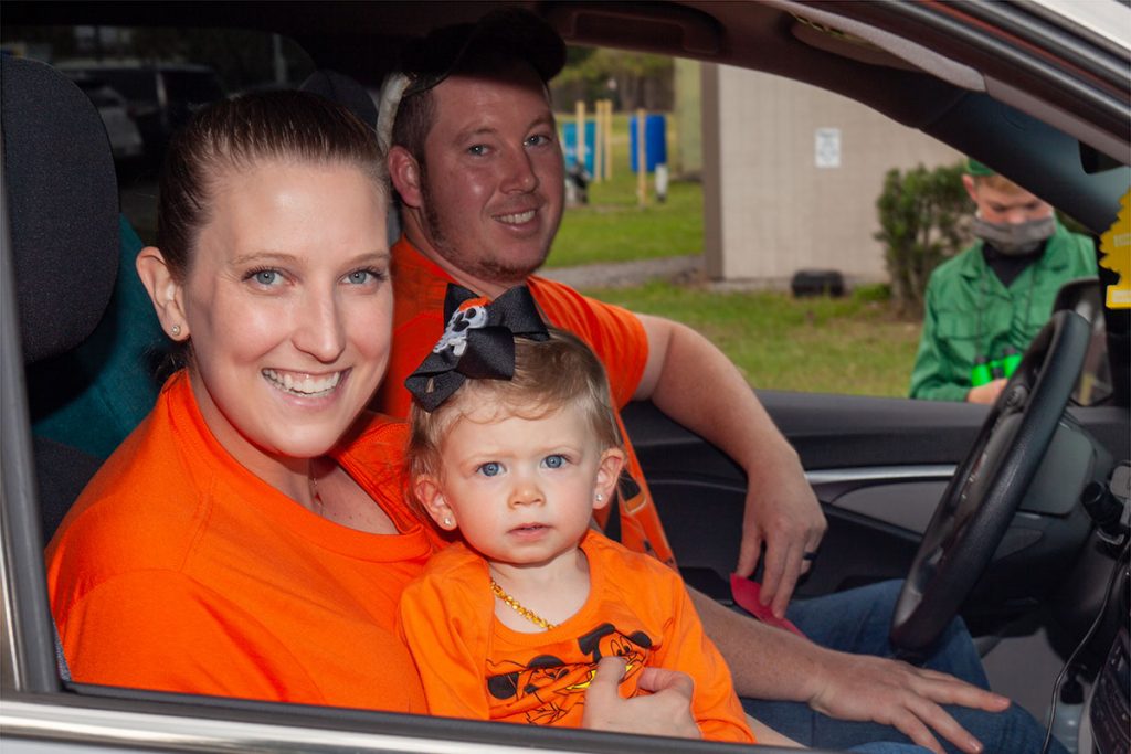 Two generations of attendees enjoying the drive-in movie