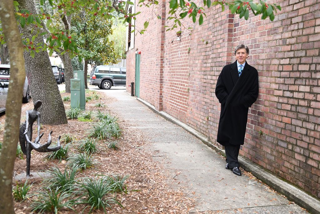 Zimmerman Boulos stands adjacent to his favorite piece of art, “A Joyous Ride” on Carlo Street, which also contains a mural, and will soon get more enhancements due to the efforts of a few passionate locals.