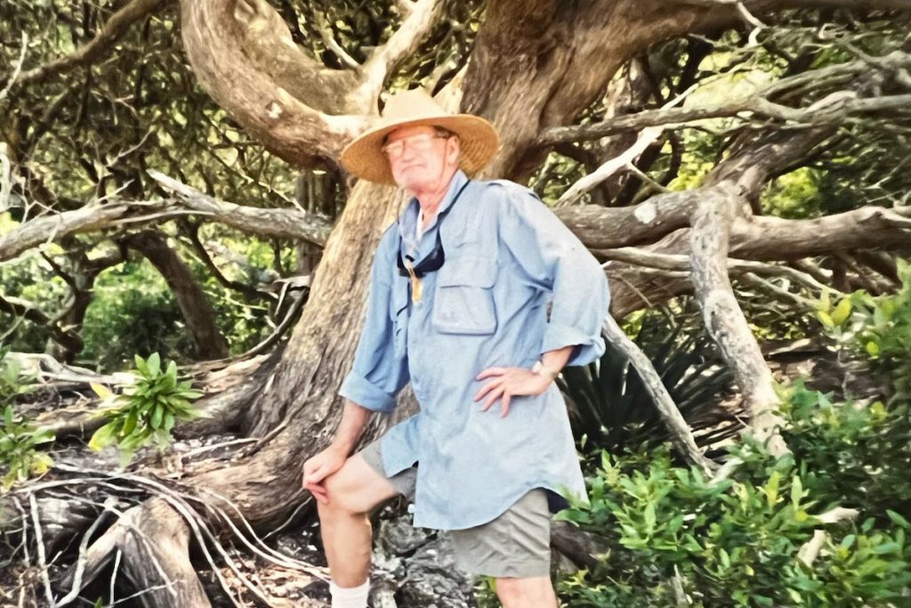 Artist Jim Pearce stands before the tree that inspired his “Generations” watercolor, the title piece for the upcoming exhibit at Karpeles Manuscript Library Museum. Photo Courtesy of Jim and Mimi Sherman Pearce.