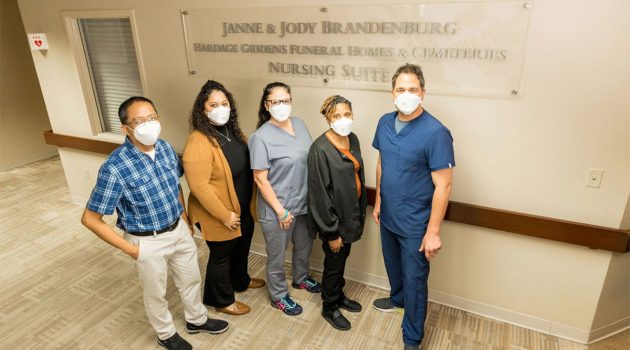 Local philanthropists honored in sign unveiling