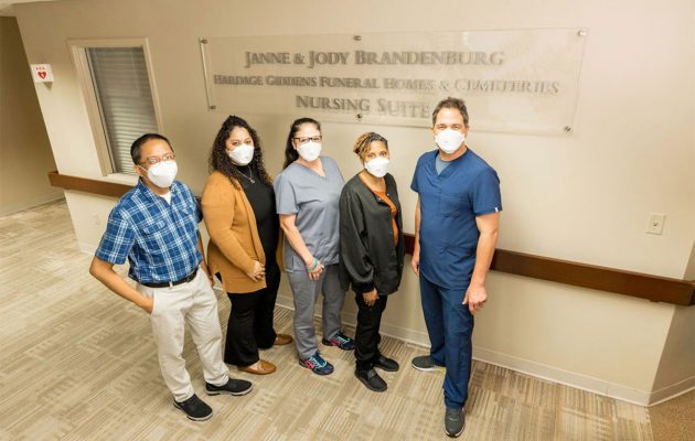 Local philanthropists honored in sign unveiling