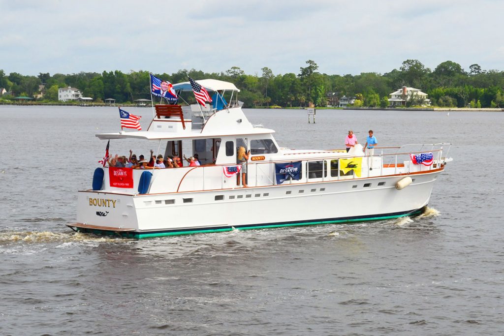 people on boat with American flags