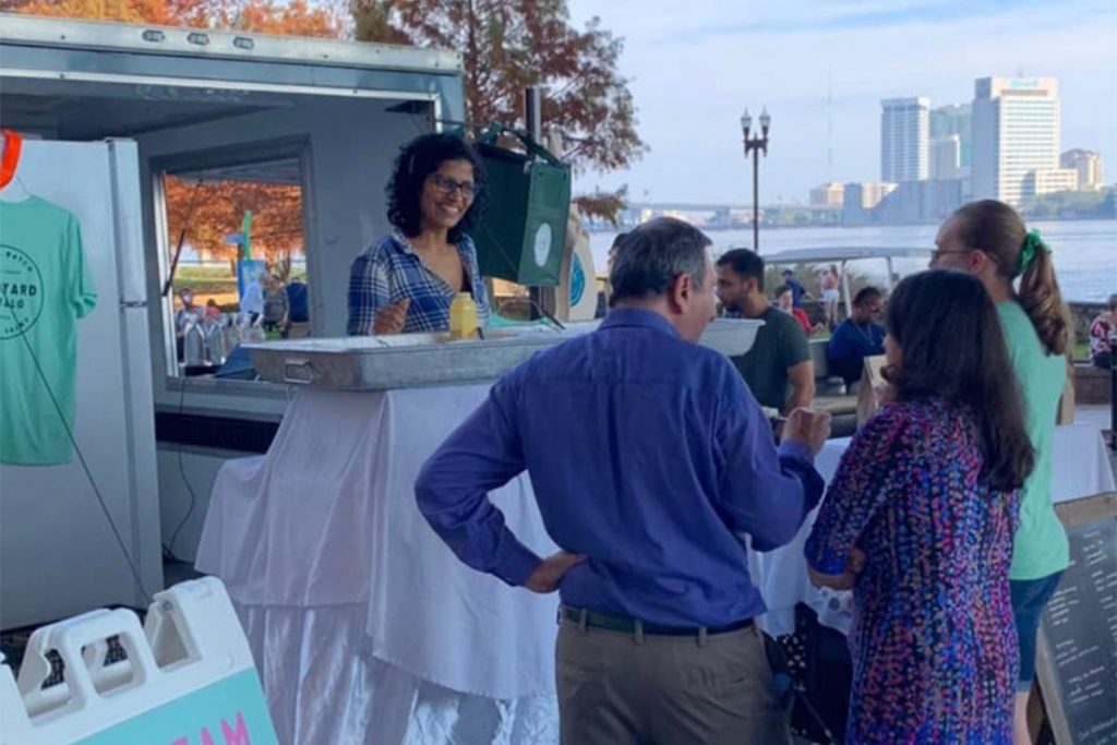 People outside at Riverside Arts Market | Picture credit @caroneats on Instagram, Backyard Buffalo Facebook