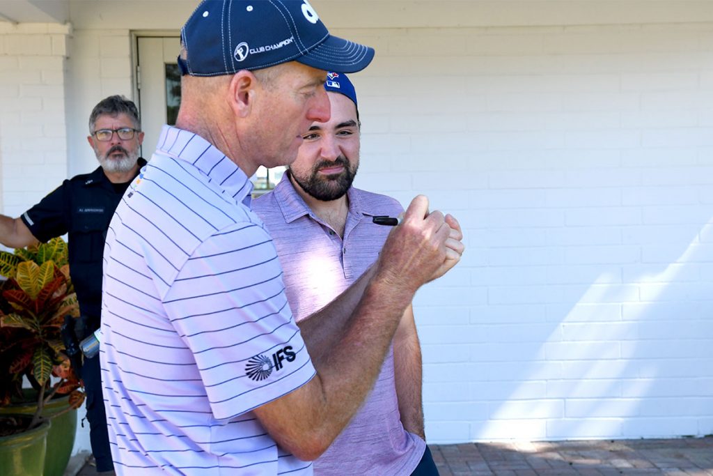 Jim Furyk signs a ball for a fan