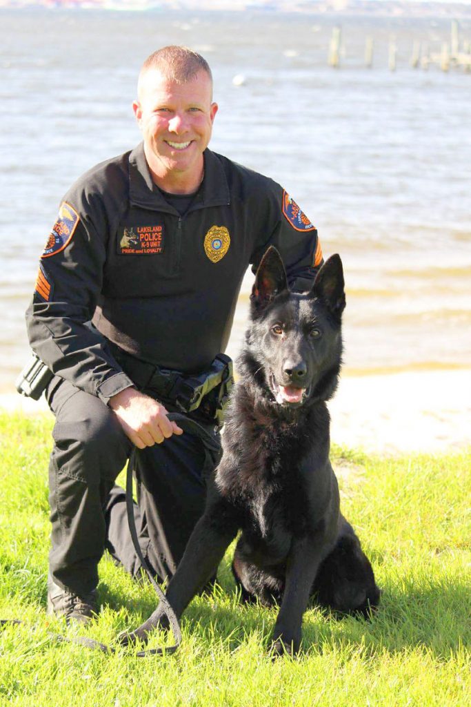 Sergeant Aaron Peterman with K9 Blizzard.
