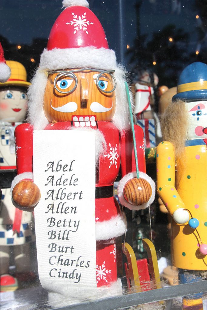 Nutcracker Santa holding a list of names