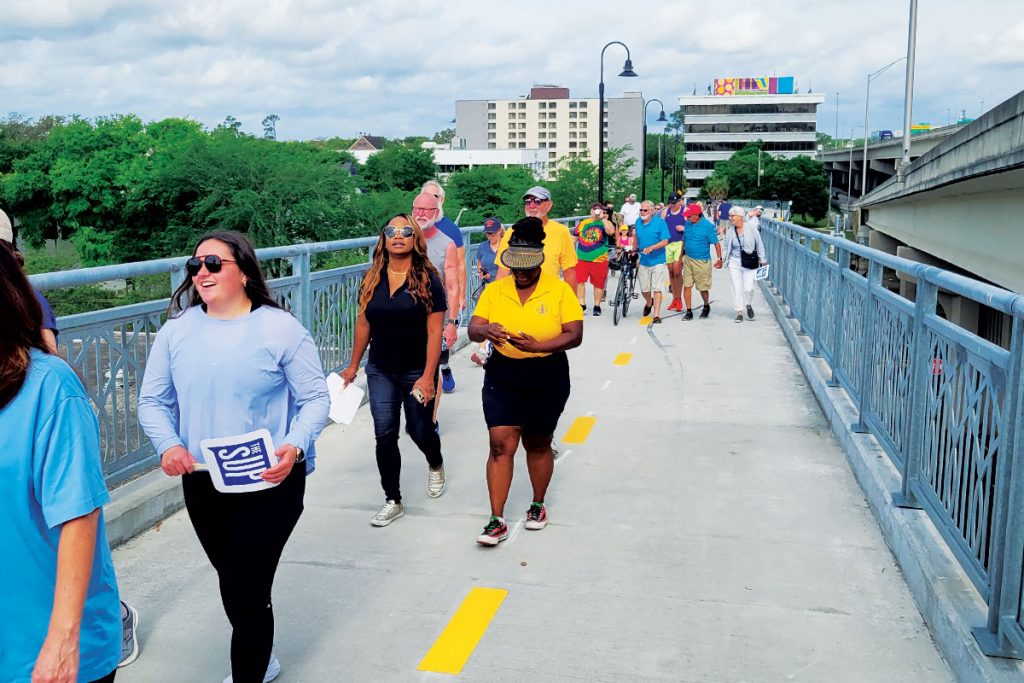 Pedestrians and bicyclists crossing the Fuller Warren SUP.