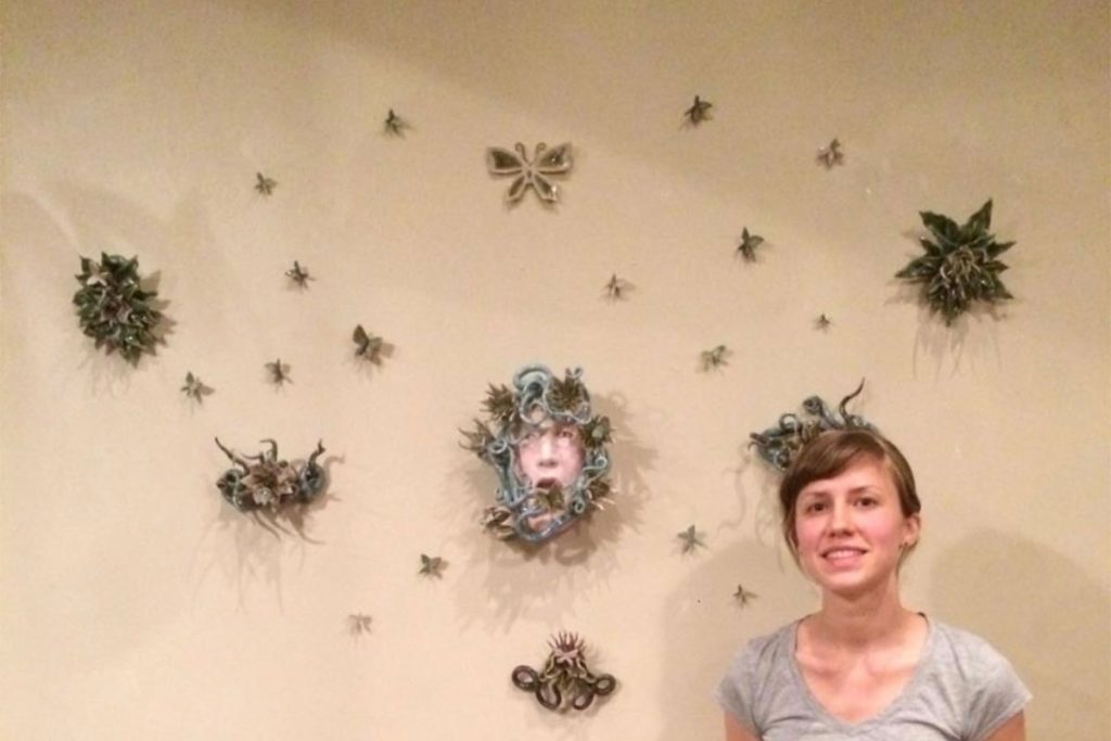 Rebecca with her art | Photo Credit Rebecca Campbell