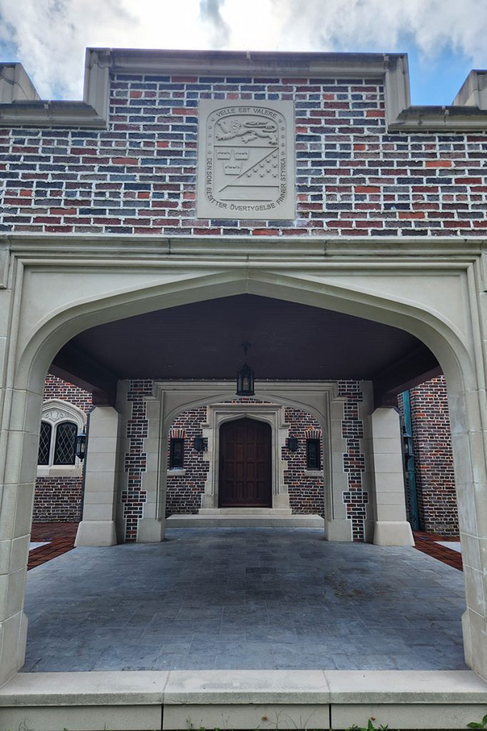 large brick overhang with emblem