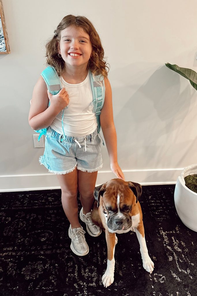 Heidi got a little help from her furry friend, Finn, on her first day of school. | Photo/Cadie Fletcher