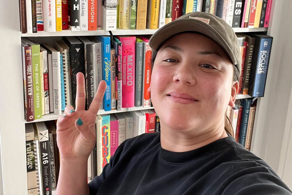 Erica Lovelace with her cookbook collection.