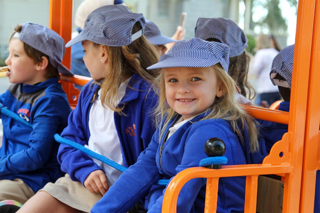 kids smiling on train