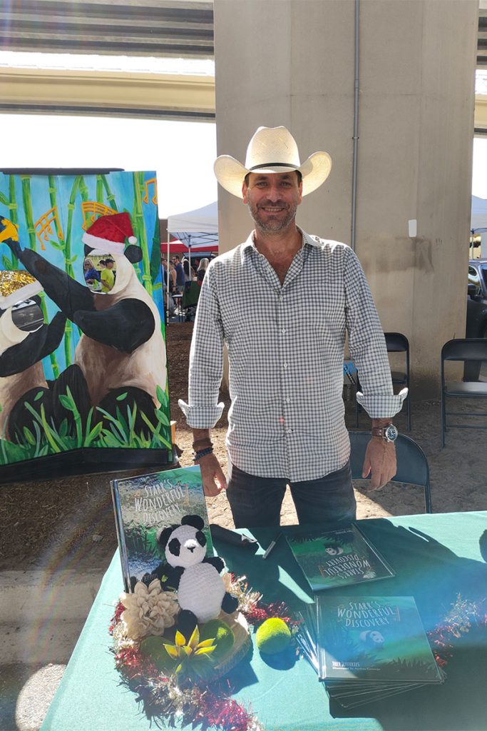 man in cowboy hat smiling