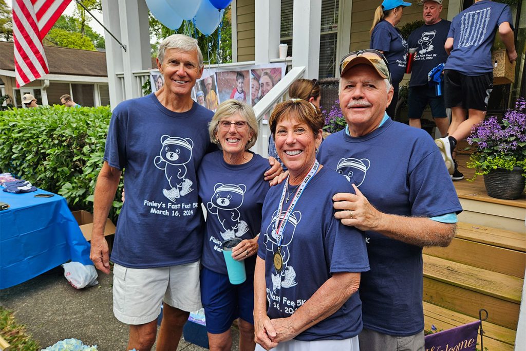 Finley’s grandparents, Gary and Barbara Johnson, with Anne and Gary Emig, who volunteer and fundraise for SUDC.