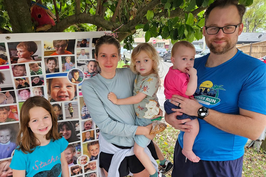 Ryan, Kate, Dean, Rory and Devon stand in front of the remembrance image of their daughter and sibling, Reese Avery Eberling (12.11.18-5.12.20).