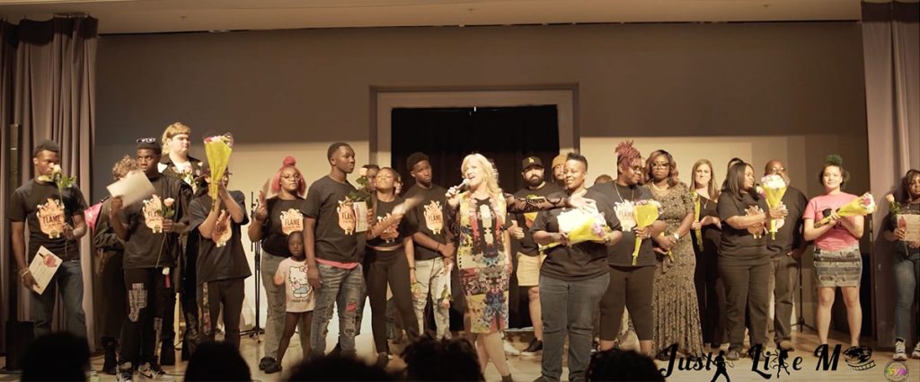 Kathryn McAvoy on stage with the participants of The Performers Academy’s Just Like Me Cultural Arts and Educational Experience.