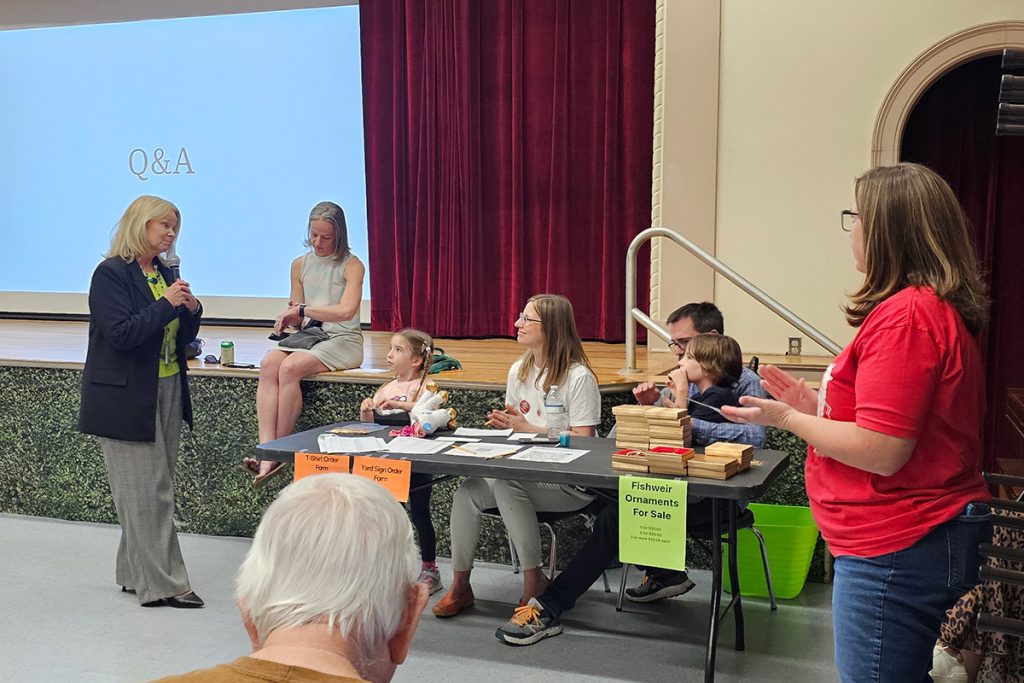 DCPS Superintendent Dr. Dana Kriznar speaking to Fishweir Elementary School student Oscar B., who asked about the likelihood of Fishweir closing.