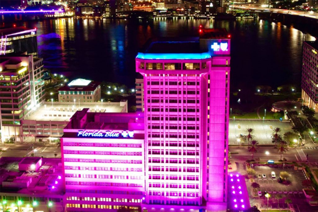 Florida Blue building lit up in pink
