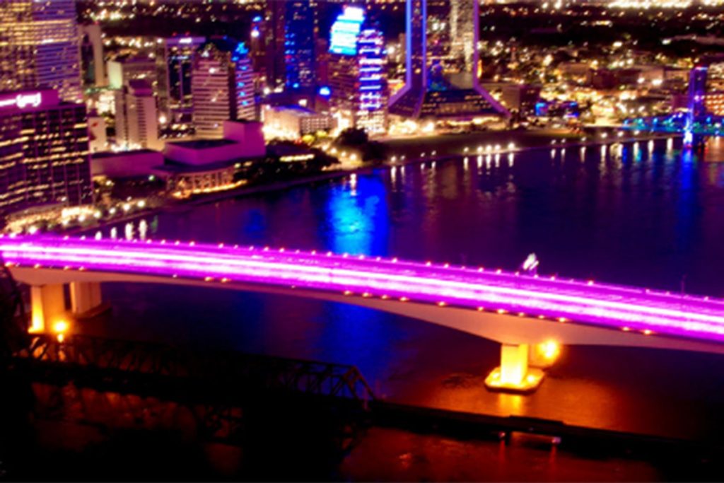 Acosta Bridge lit up in pink